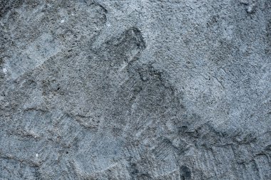 Eski bir beton duvarın pürüzlü yüzeyi