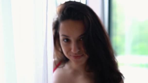 Camera Moving Back Young Sexy Attractive Woman Standing Bedroom Window — Vídeo de Stock