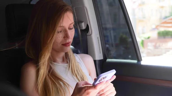 Businesswoman Texting Message Smartphone While Sitting Back Seat Taxi Close — Fotografia de Stock