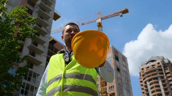 Bottom View Joyful Young Caucasian Man Builder Standing Front Construction — Foto Stock