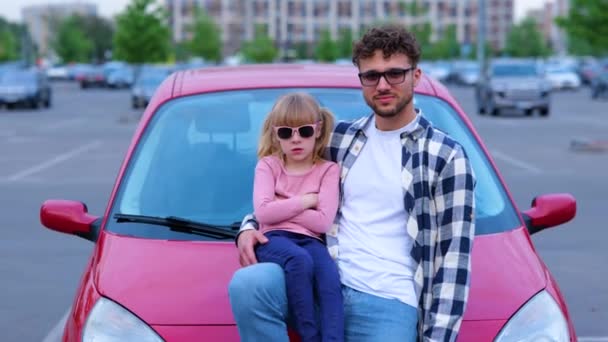 Smiling Young Father Her Daughter Wearing Sunglasses Leaning Hood Red — Stock Video