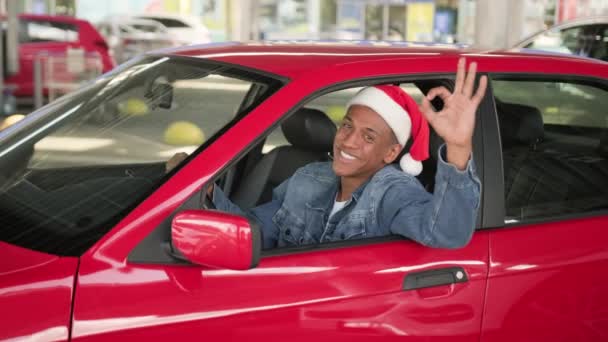 Happy African American Guy Showing Gesture While Looking Out Car — Stock Video