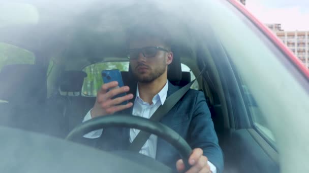 Young Handsome Businessman Using Smartphone While Driving Car Work City — Stock Video
