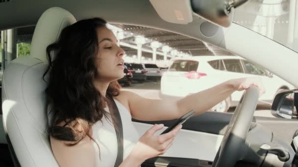 Young Woman Using Seat Belt Driving Car City Using Mobile — Stock Video