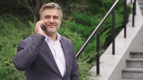 Happy Adult Man Standing Steps Outdoors While Talking Phone Business — Stock Video
