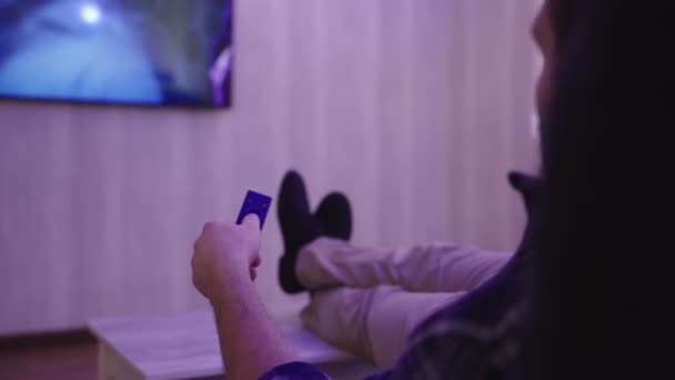 Man Relaxing Home Evening Watching While Switching Channels Using Remote — 비디오