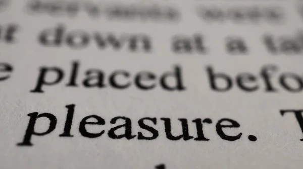 Pleasure Text Open Book Page Selective Focus Close Macro Shot — Stock Photo, Image