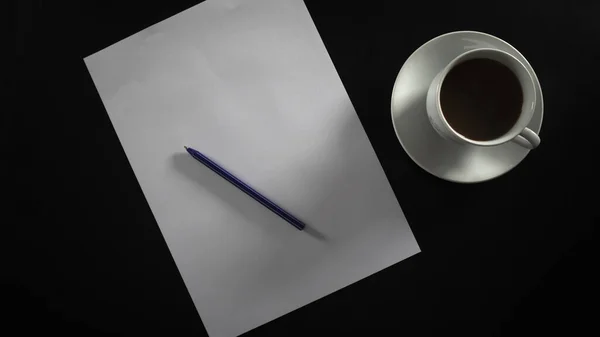 Writing and drinking filter coffee in white cup and coaster, drip coffee and paper on black table, blank and pen, isolated on black background, top view