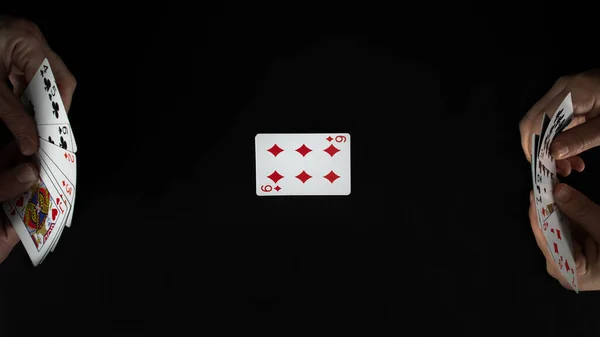 Playing cards deck, entertainment with cards, in a row, isolated on black background, top view