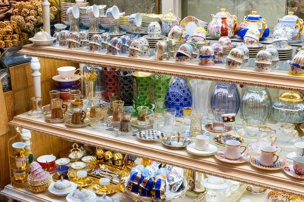 Colorful traditional and souvenir handmade glassware footage from Misir bazaar stand, shopping in a bazaar, arcade market stands, tea and coffee cups, colored Turkish teapots, glass art concept