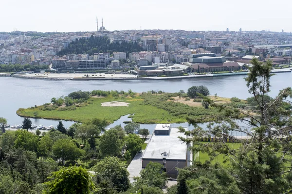 Wide Golden Horn island view from Pierre Loti, Golden Horn with trees and buildings, sunny day and blue sky, beautiful landscape in Istanbul, known as Halic