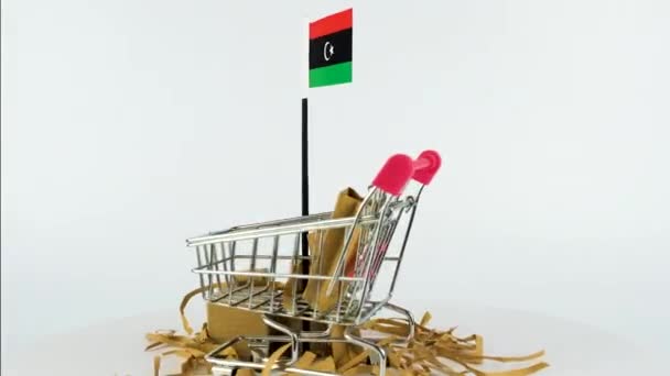 スーパーマーケットの手提げカートや段ボール箱のビデオでリビアの旗 Fps オンラインマーケティングやショッピングの概念 外国貿易のアイデア リビアで製品を販売 プラットフォームを回す 電子商取引ビデオ — ストック動画