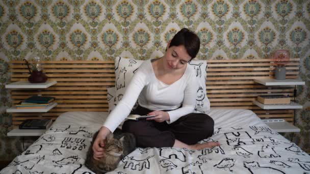 Beautiful Woman Playing Cat Bedroom While Writing Notes Her Planner — Stockvideo