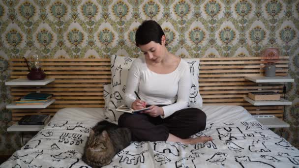 Beautiful Woman Playing Cat Bedroom While Writing Notes Her Planner — Stockvideo
