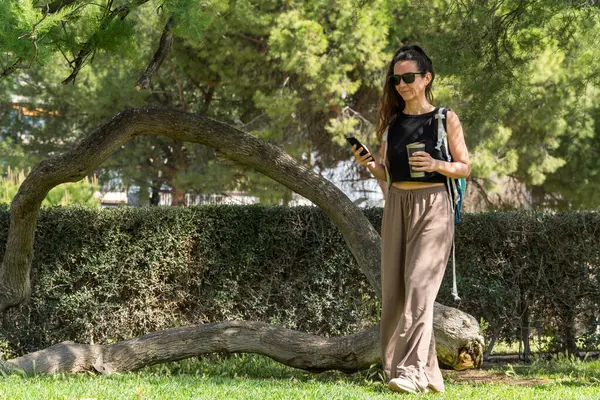 beautiful woman with a dog in the park