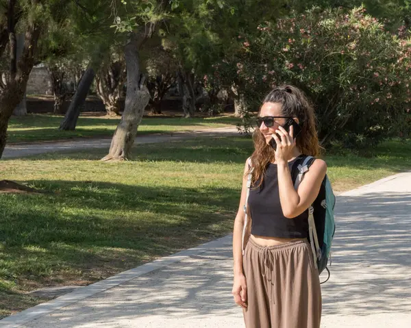 woman with smartphone in the park