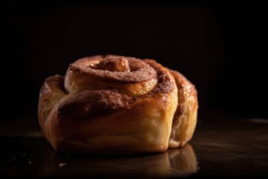 homemade cinnamon buns on a black background