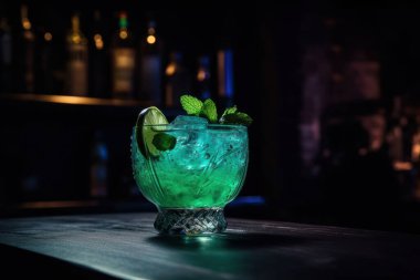 a glass of cocktail with a lemon and a black background