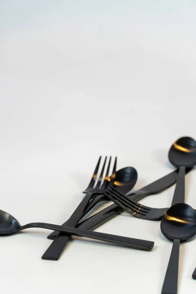 Black Metal Dinnerware Cutlery Utensils Forks Knives Spoons Gray Background — Stock Photo, Image