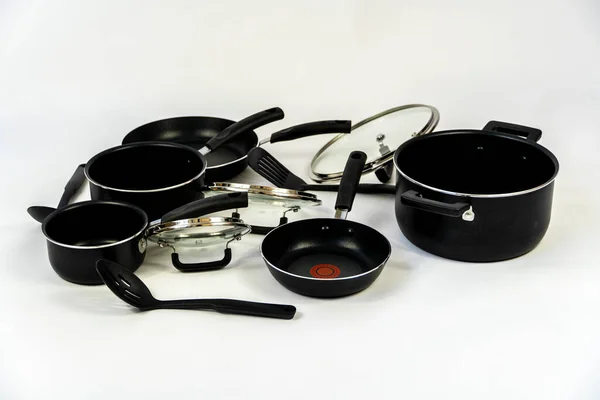 cookware set, steel dinner set isolated on white background, black metal cookware set guadalajara, jalisco