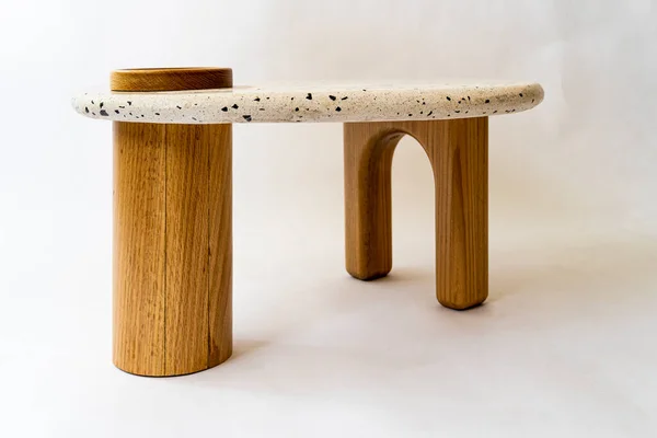 designer coffee table, solid wood base and top in terrazzo, oak wood on white background, mexico latin america