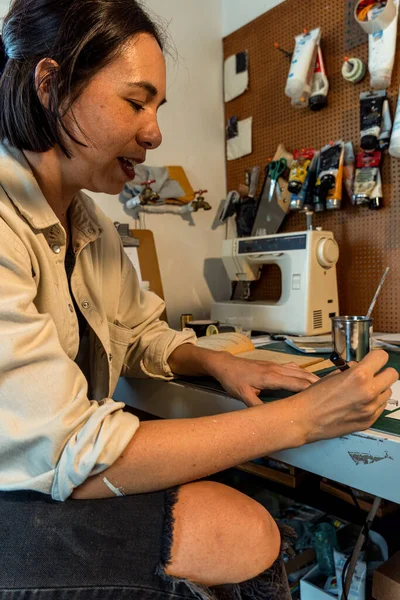 stock image young latin woman, in her own painting and sculpture studio, creates paintings with different artistic techniques mexico latin america