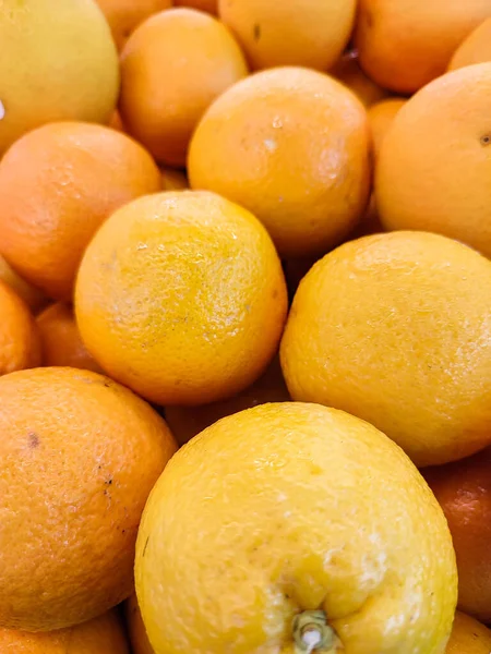 pile of oranges sold in supermarket, collection of abstract backgroud or wallpaper for ads banner or website, fresh mandarin oranges texture