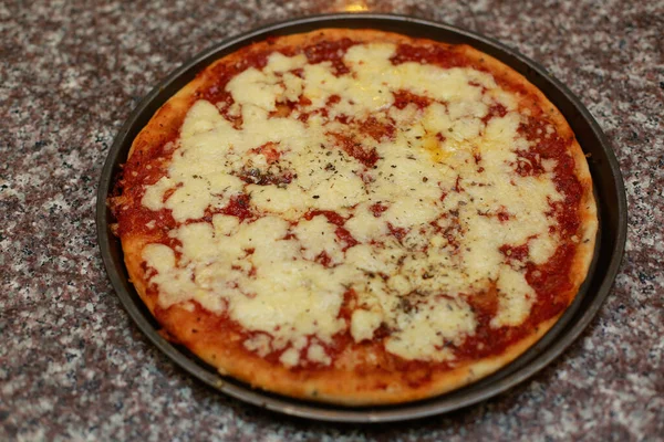 stock image pizza with cheese and tomato sauce