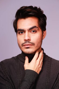 Confident man in a black sweater, portrait