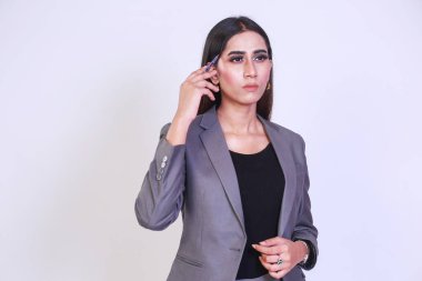 Young entrepreneur woman thinking for a solution while Giving a presentation to a client or colleagues. Successful business woman in a formal suite. Isolated on White background