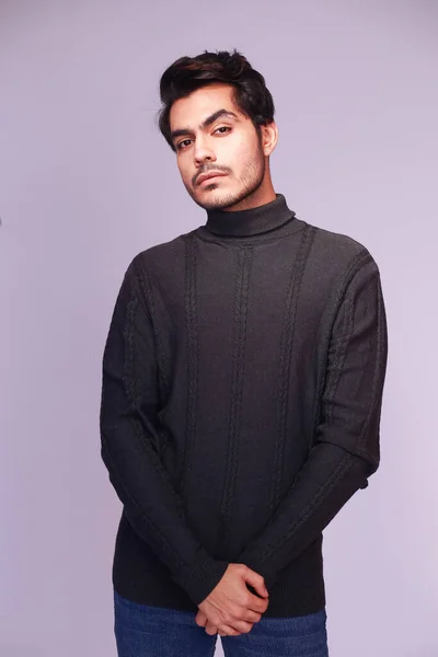 Confident man in a black sweater, portrait