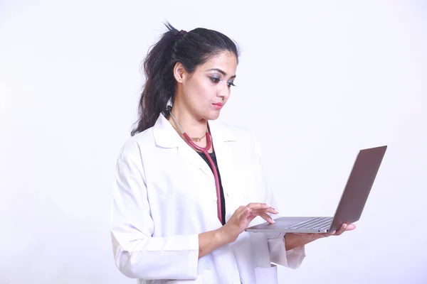 Pakistani female doctor make online video call consult patient on laptop. Medical assistant young woman therapist videoconferencing to web camera. Telemedicine concept. Online doctor appointment.