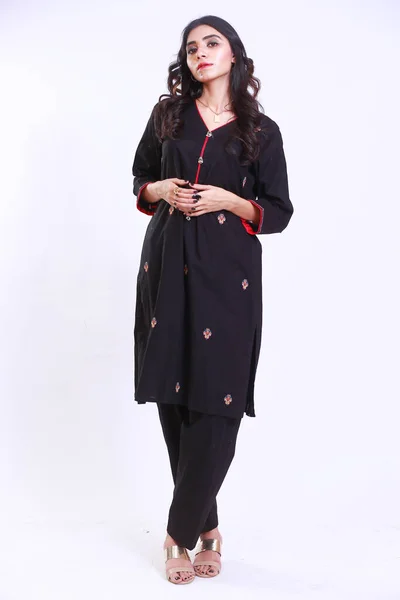 Pakistani Woman in Traditional embroidery black kameez shalwar dress. Fashion Concept