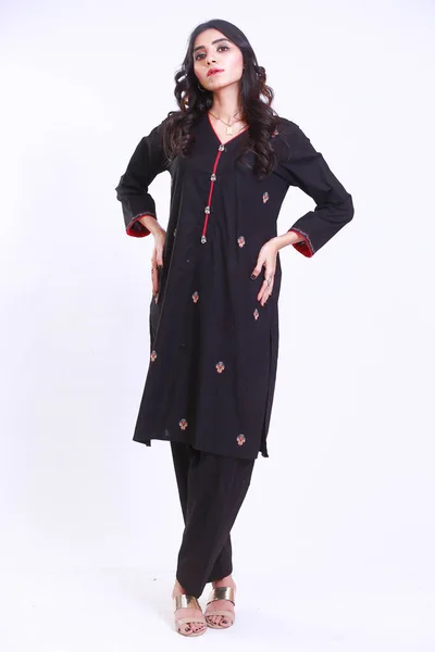 Pakistani Woman in Traditional embroidery black kameez shalwar dress. Fashion Concept