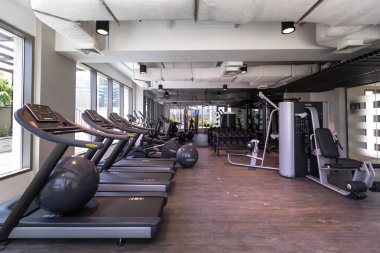 Dubai, United Arab Emirates 02/26/2020: fitness gym at Jannah apartments in Nshama Townsquare clipart