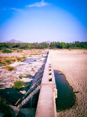Natural view of dam or river in India clipart