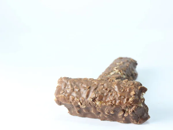 macro shot of a pile chocolate bar isolated on a white background