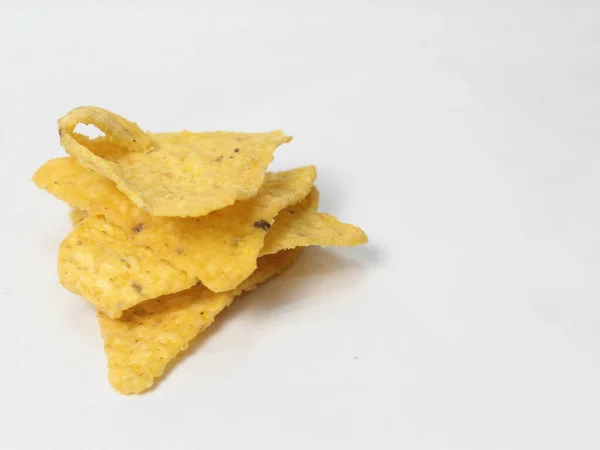 crispy tortilla chips isolated on white background