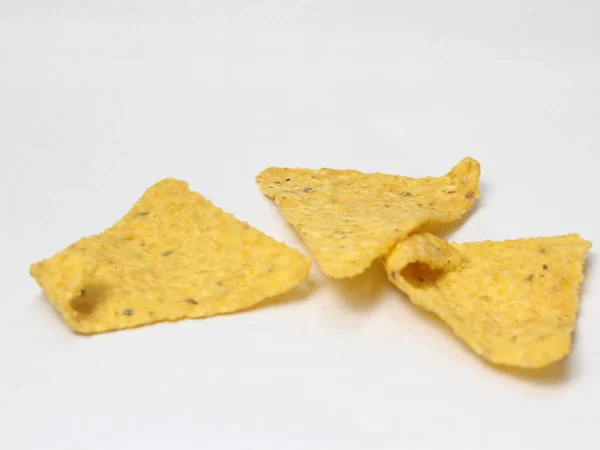 nacho corn chips isolated on white background, side view