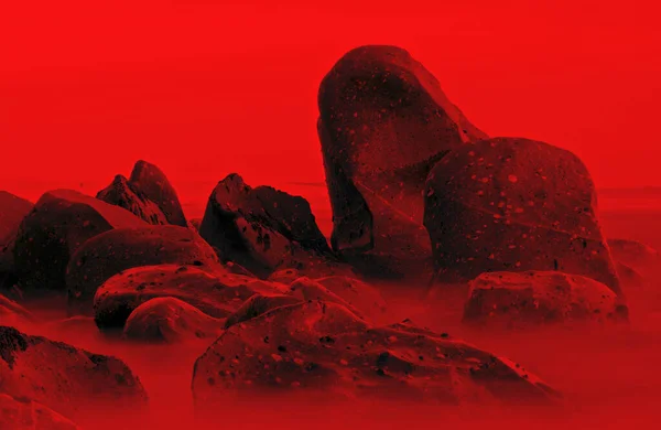Red Tide, Coastline Sea Stones with a Red Filter, Porto, Portugal.