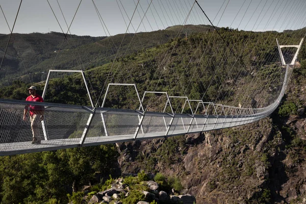 stock image 2 July 2023, Walking trough the 516 Suspension Bridge in AroucaGeoPark, Arouca, Portugal.