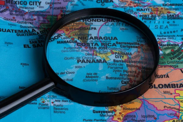 Map of Panama through magnifying glass.Close-up