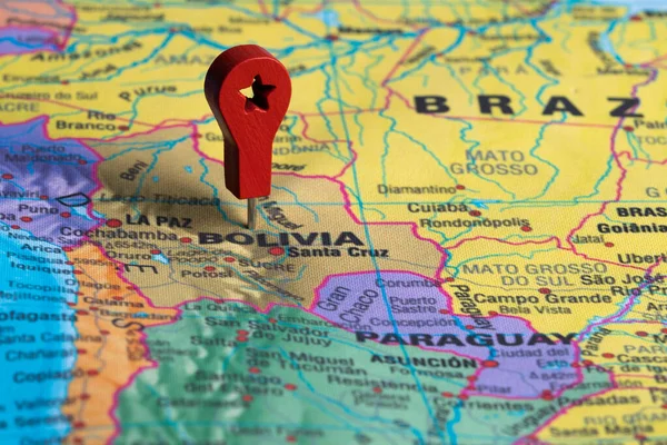Red pin, point on the map of Bolivia. Concept travel background