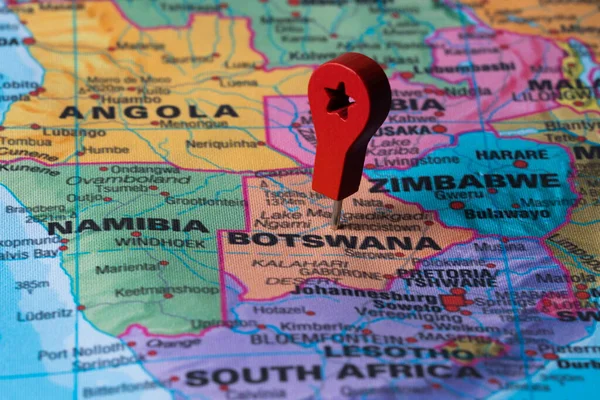 Red pin, point on the map of Botswana. Concept travel background