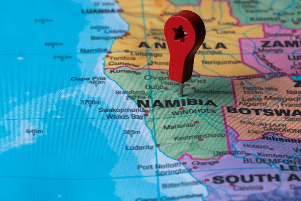 Red pin, point on the map of Namibia. Concept travel background
