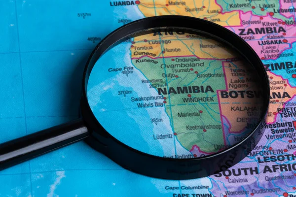 Map of Namibia through magnifying glass.Close-up