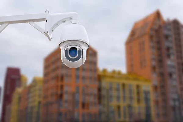 stock image Modern public CCTV camera with blur building background. Recording cameras for monitoring all day and night. Concept of surveillance and monitoring with copy space