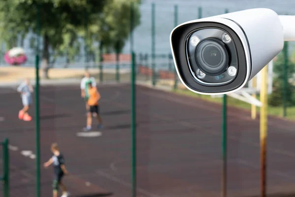 Outdoor CCTV monitoring, security cameras at a school playground.