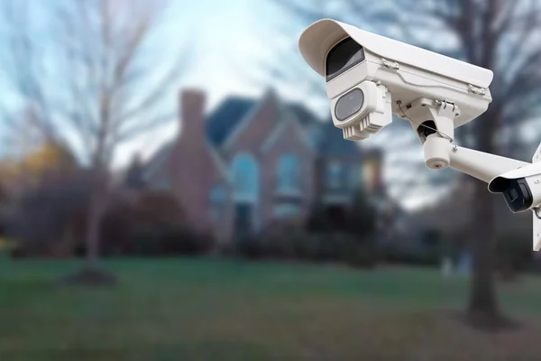 CCTV Camera or surveillance operating with house village in background