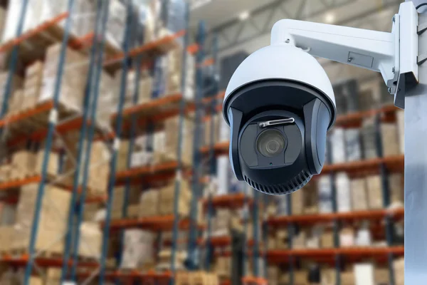 CCTV Camera Operating inside warehouse or factory. Copy space